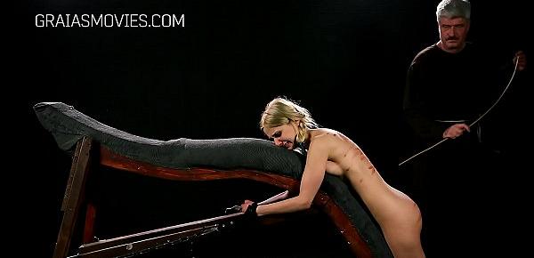  Little blonde whore caned while chained down